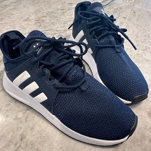 New without box. Never worn Adidas ortholite navy blue sneakers. Size 1.